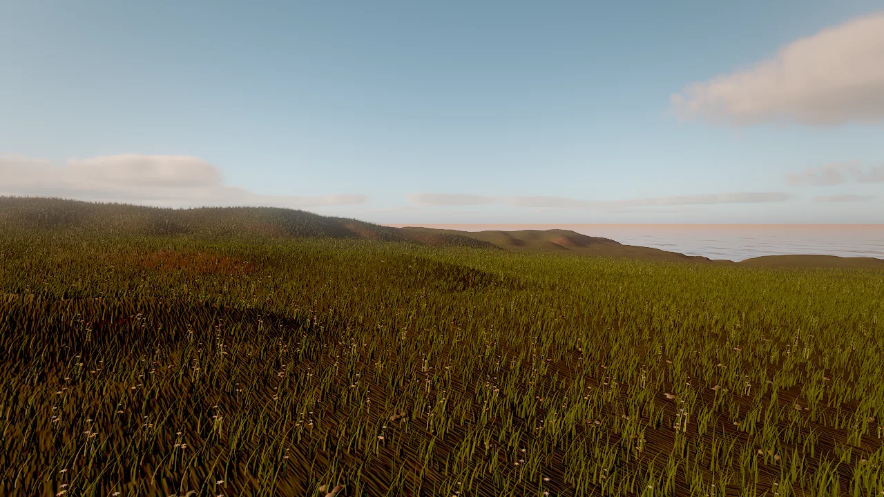 A meadow of grass over rolling coastal hills